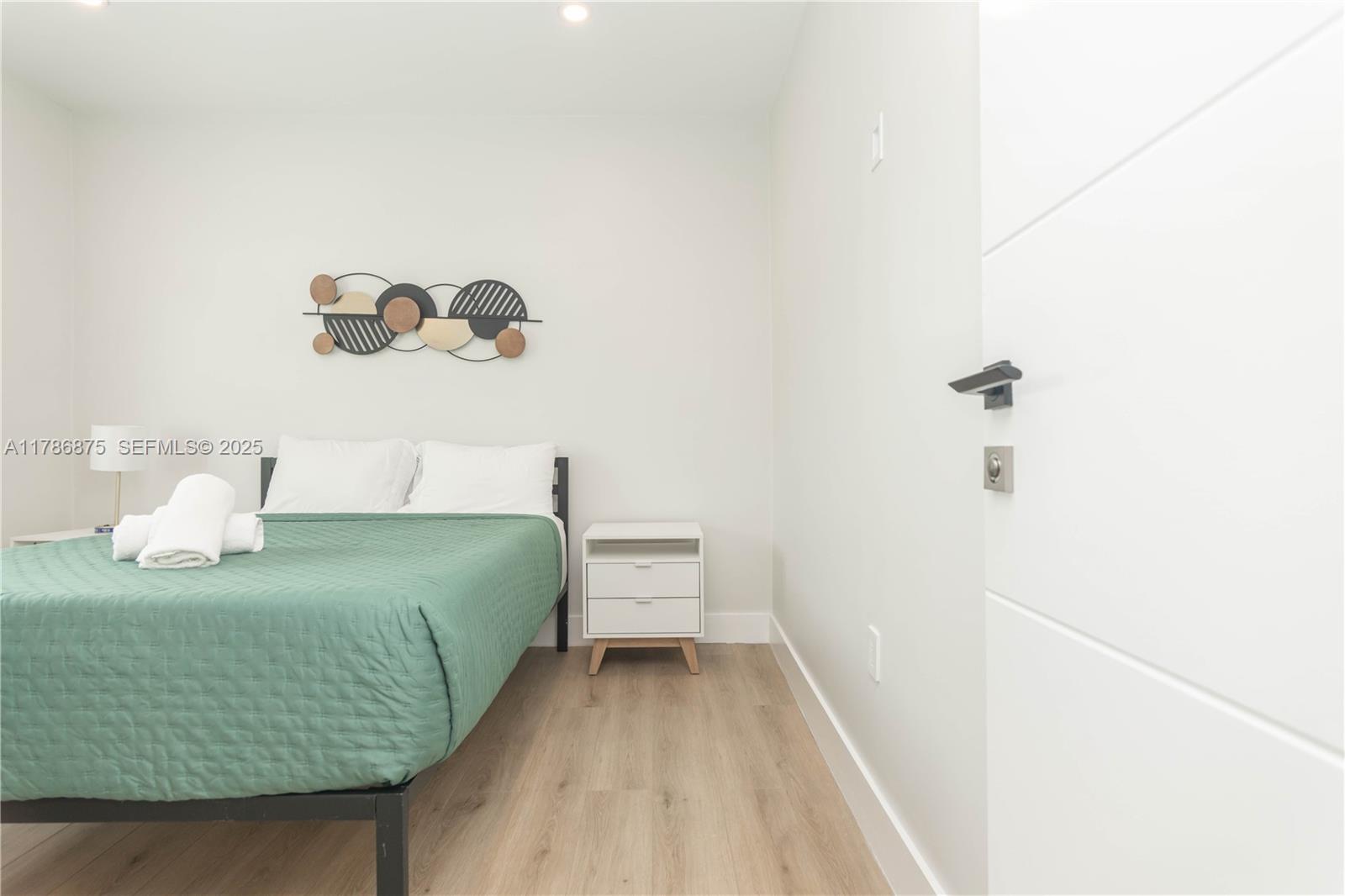 2360 Southwest 12th Street Miami, FL 33135 - Photo 55 of 78 a bedroom with a bed and painting on the wall