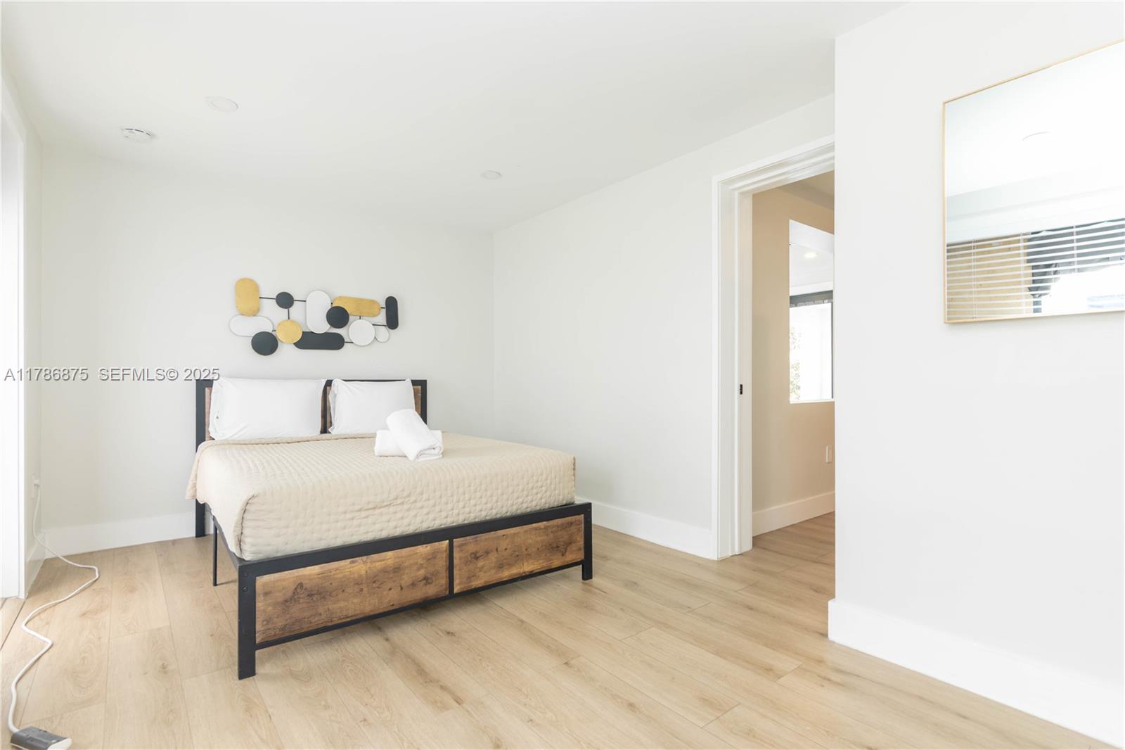 2360 Southwest 12th Street Miami, FL 33135 - Photo 65 of 78 a large bed sitting in a bedroom next to a window