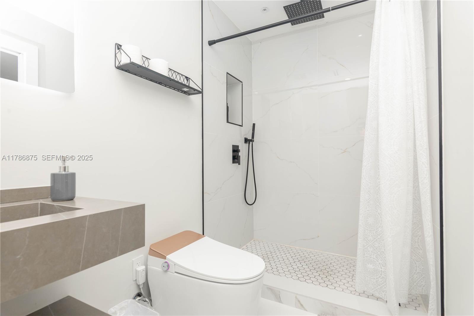 2360 Southwest 12th Street Miami, FL 33135 - Photo 70 of 78 a bathroom with a shower a toilet and a sink