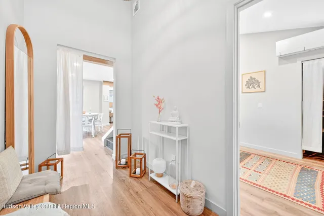 a bedroom with furniture and a window