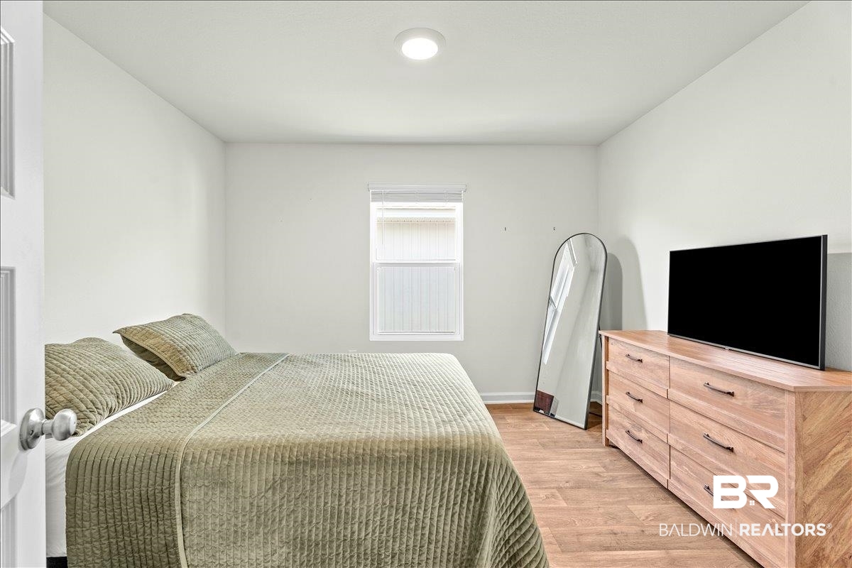 23641 Unbridled Loop Daphne, AL 36526 - Photo 22 of 40 Bright room featuring wood-finish flooring and a single window with blinds
