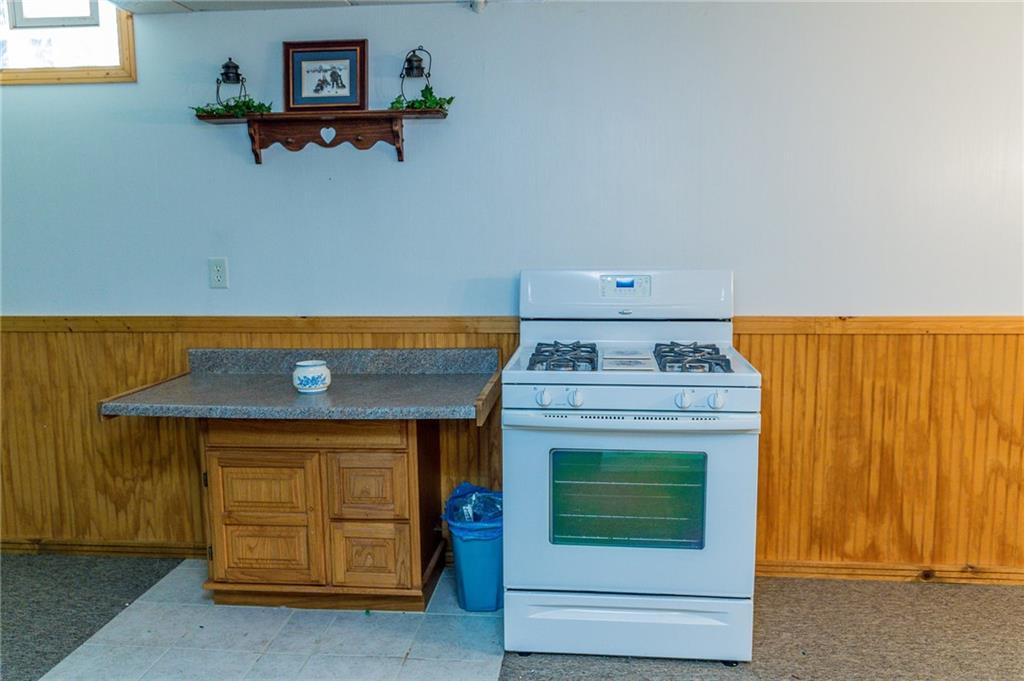 131 West Brewster Road Butler, PA 16001 - Photo 22 of 25 Extra prep counter and cabinet along with gas stove complete the kitchen area. Stove stays with property