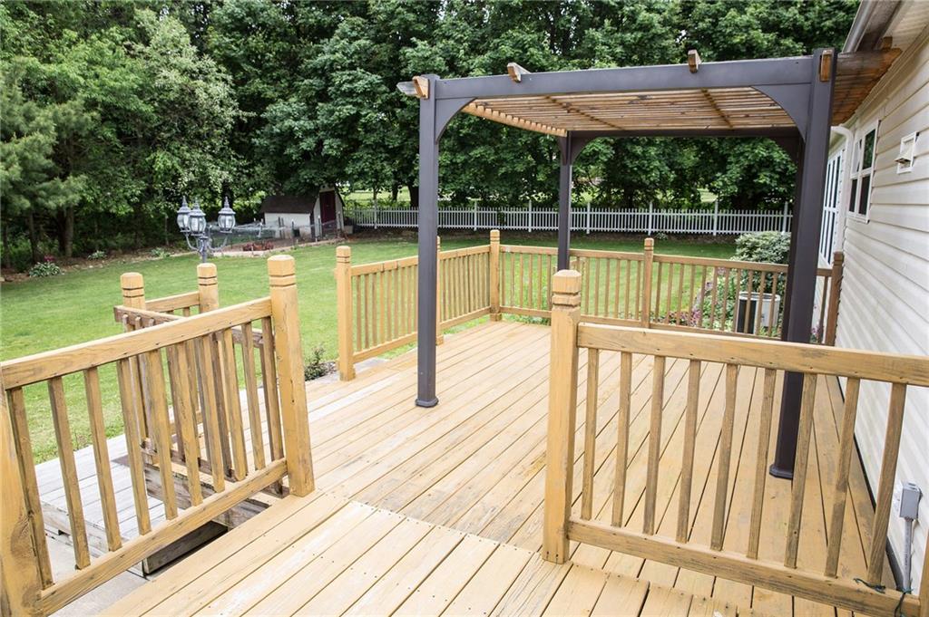 131 West Brewster Road Butler, PA 16001 - Photo 5 of 25 Two tiered deck on back of home with Pergola for your entertaining! Pergola cover is in the basement and can be added for extra shade. Very private backyard completely surrounded by trees, and line with lovely white picket fence.