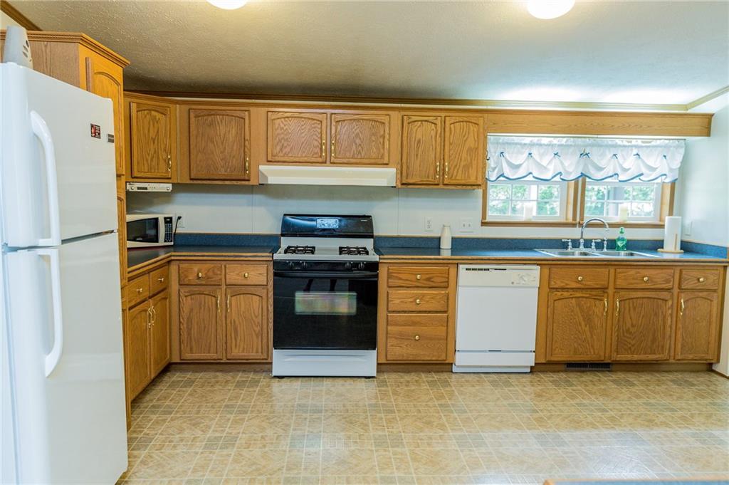 131 West Brewster Road Butler, PA 16001 - Photo 7 of 25 Kitchen is easily large enough for eat in kitchen table if you need extra space