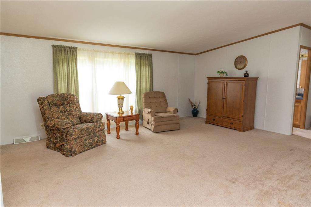 131 West Brewster Road Butler, PA 16001 - Photo 8 of 25 One of 2 very spacious family room areas with freshly cleaned carpets and neutral surroundings.