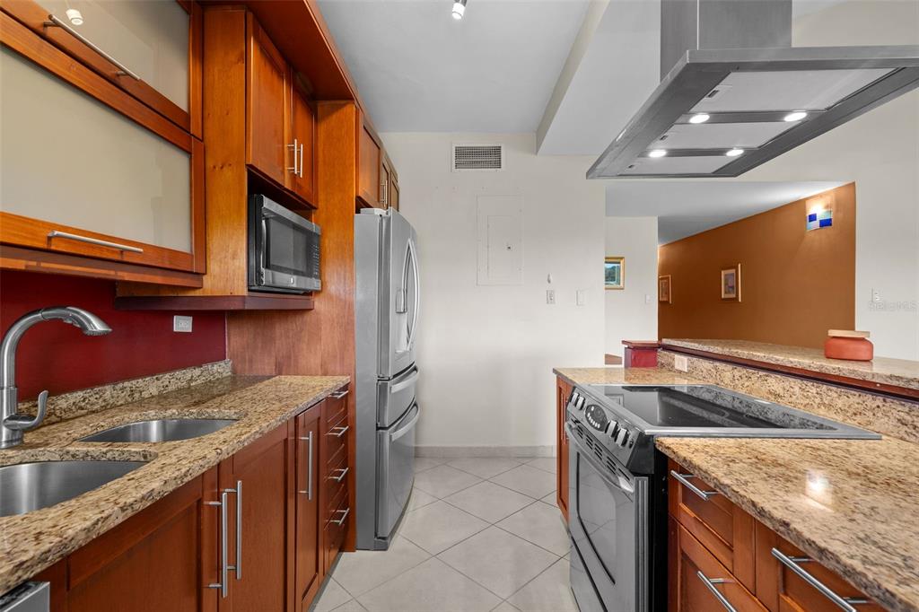 * Academy Drive Drive, Unit 25 Humacao, PR 00791 - Photo 12 of 37 a kitchen that has a sink and a stove