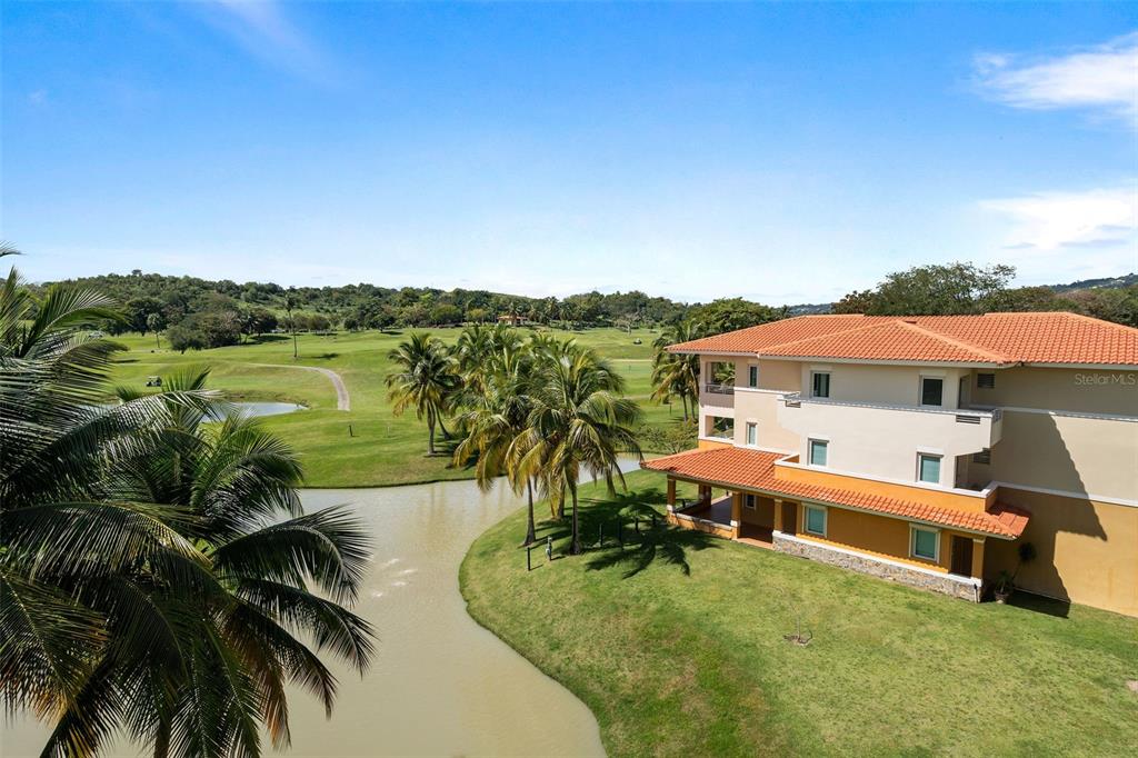 * Academy Drive Drive, Unit 25 Humacao, PR 00791 - Photo 17 of 37 an aerial view of a house with swimming pool and lake view