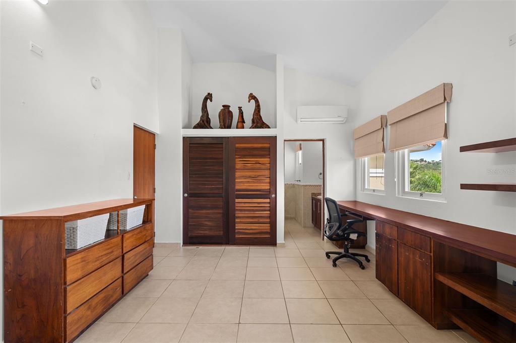 * Academy Drive Drive, Unit 25 Humacao, PR 00791 - Photo 20 of 37 a room with furniture and cabinets