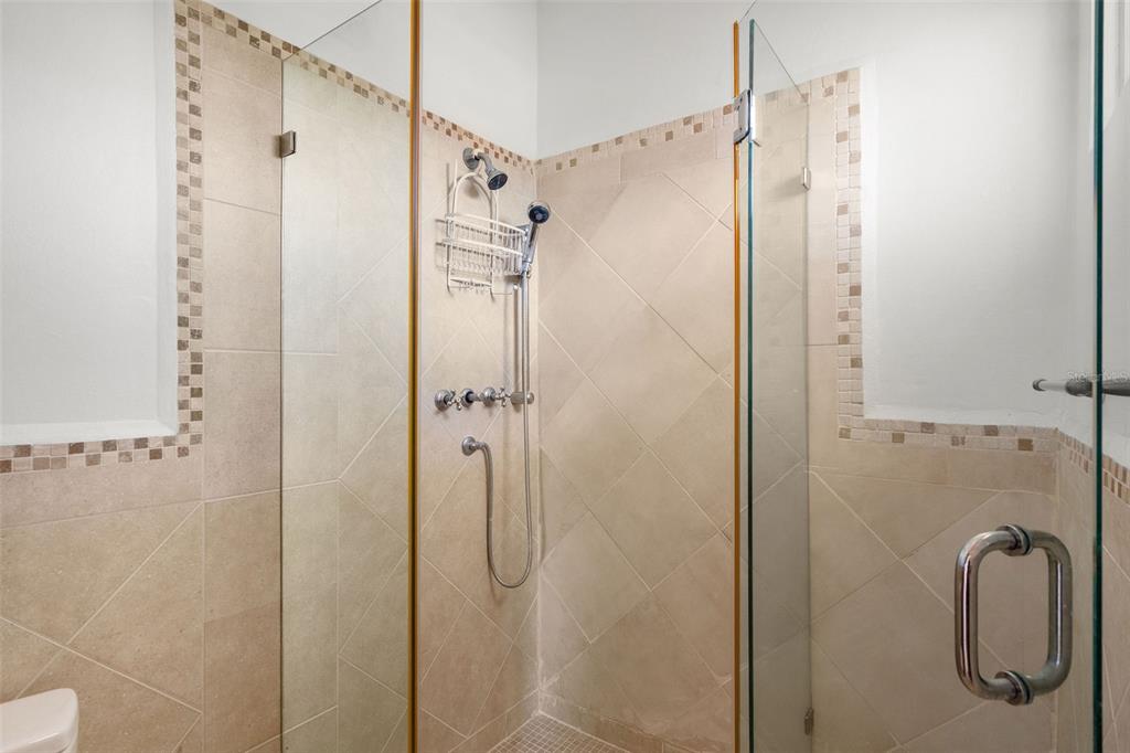 * Academy Drive Drive, Unit 25 Humacao, PR 00791 - Photo 22 of 37 a bathroom with a shower and a glass door