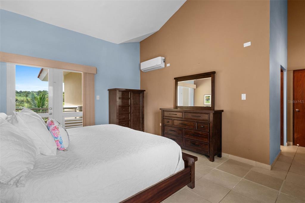 * Academy Drive Drive, Unit 25 Humacao, PR 00791 - Photo 24 of 37 a bedroom with a bed and a dresser