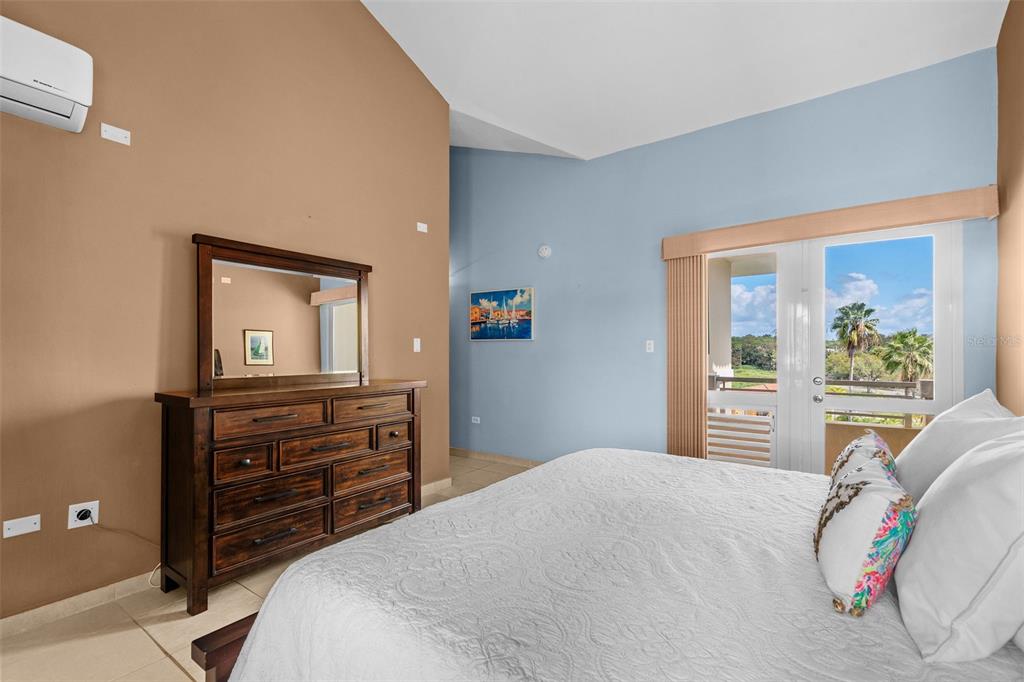 * Academy Drive Drive, Unit 25 Humacao, PR 00791 - Photo 26 of 37 a bedroom with a bed and a dresser