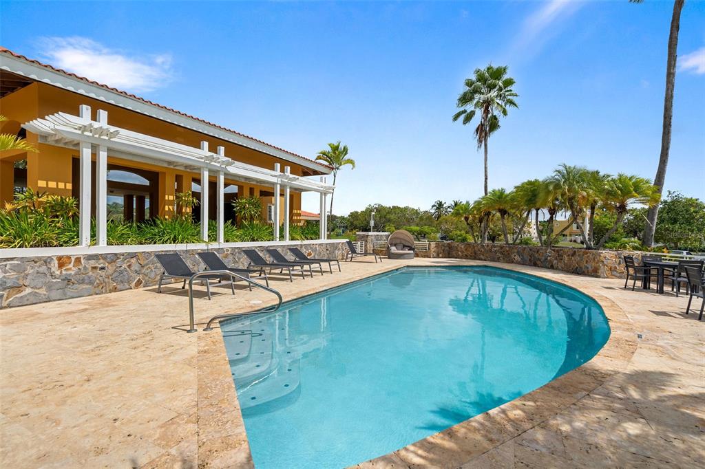 * Academy Drive Drive, Unit 25 Humacao, PR 00791 - Photo 32 of 37 a view of a swimming pool with a lounge chairs