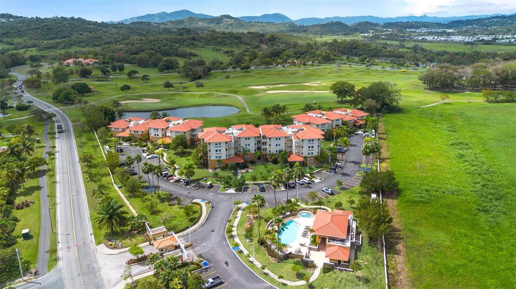 * Academy Drive Drive, Unit 25 Humacao, PR 00791 - Photo 35 of 37 a view of a swimming pool a yard and mountain