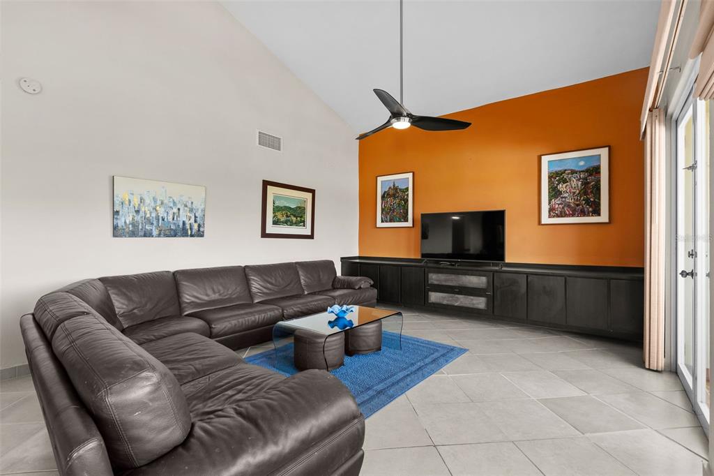 * Academy Drive Drive, Unit 25 Humacao, PR 00791 - Photo 4 of 37 a living room with furniture and a flat screen tv