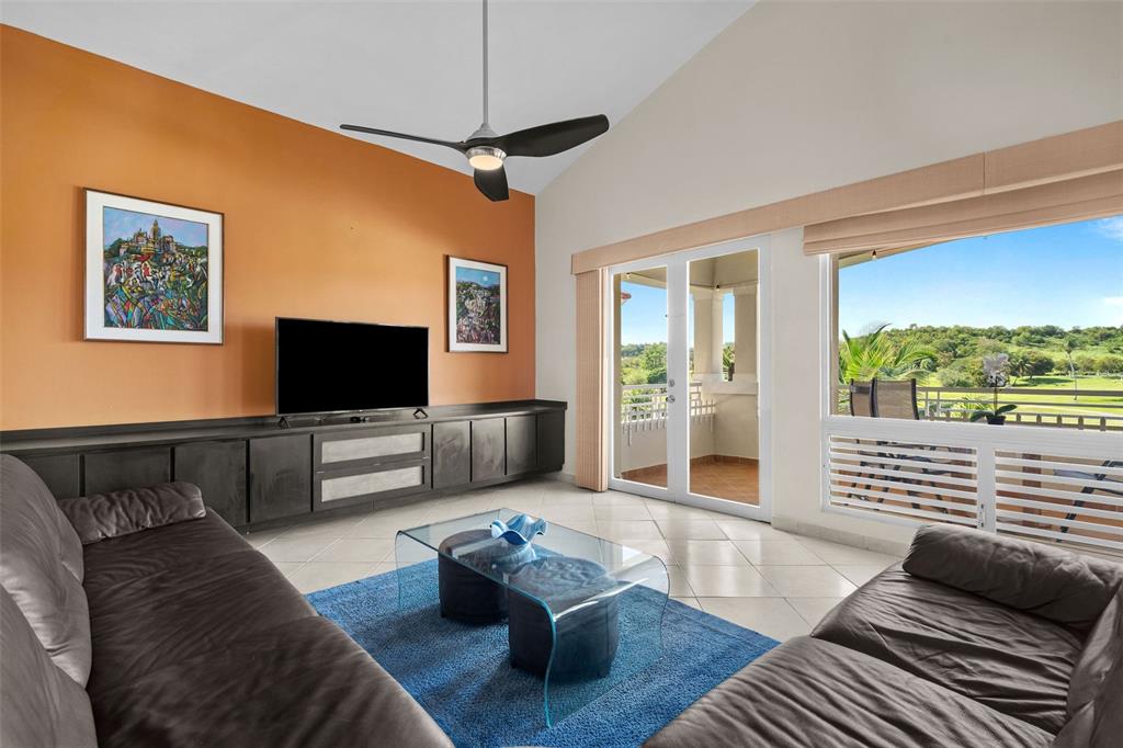 * Academy Drive Drive, Unit 25 Humacao, PR 00791 - Photo 7 of 37 a living room with furniture and a flat screen tv