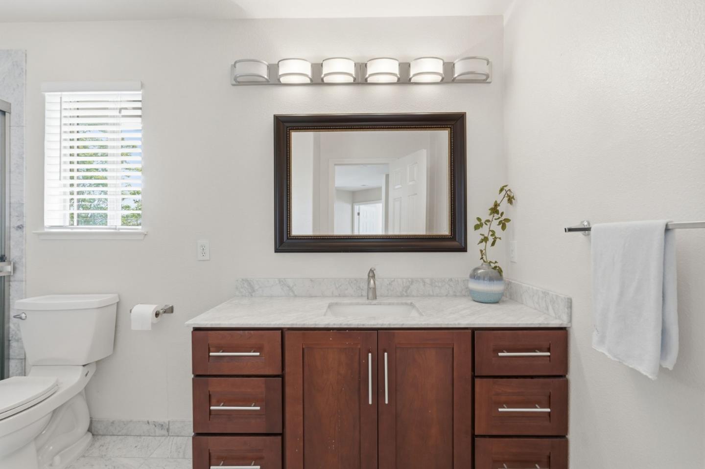 35 Sierra Ridge Court Danville, CA 94506 - Photo 33 of 37 a bathroom with a granite countertop sink a toilet and a mirror