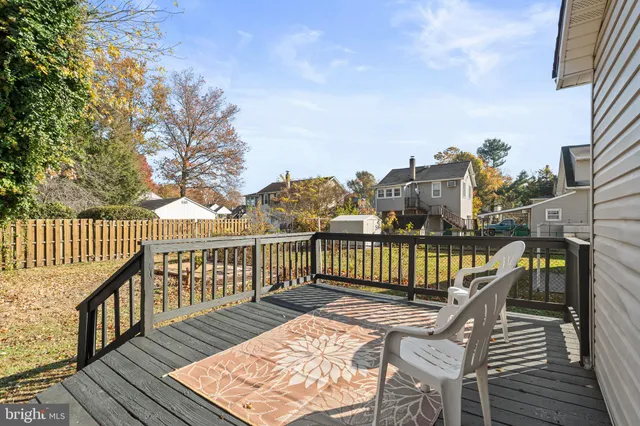 a view of a balcony with wooden floor