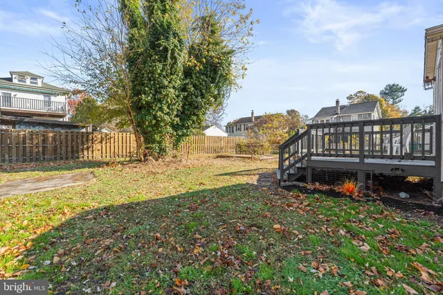 a view of a house with wooden fence