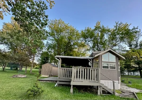 a view of a deck with a yard