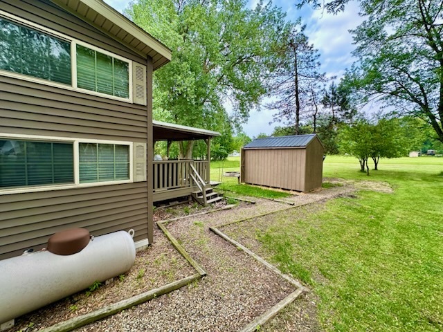 18-62-63 Woodhaven Sublette, IL 61367 - Photo 17 of 20 a view of backyard with a garden and deck