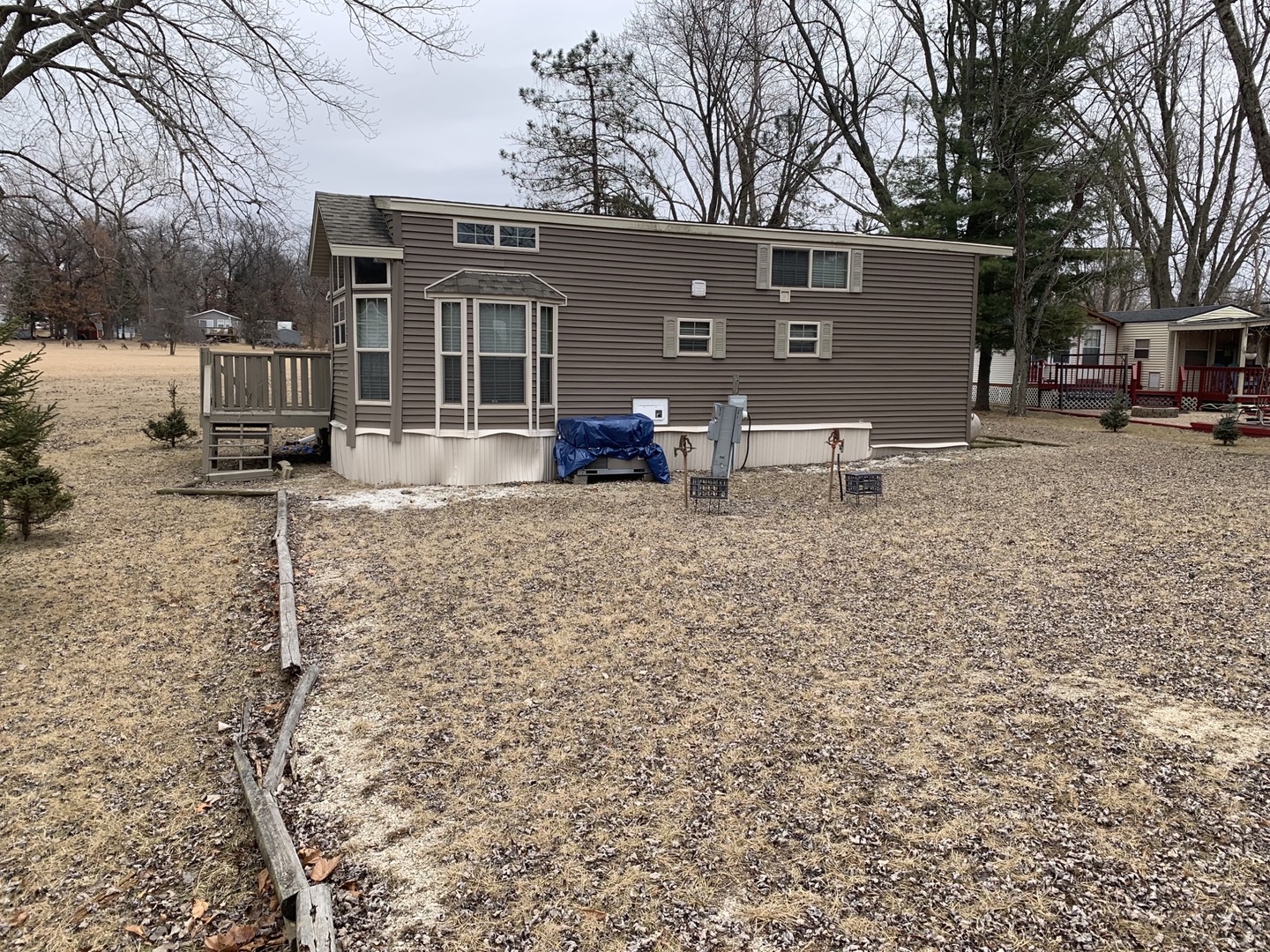18-62-63 Woodhaven Sublette, IL 61367 - Photo 2 of 20 a view of a house with a yard and a car parked in front of it
