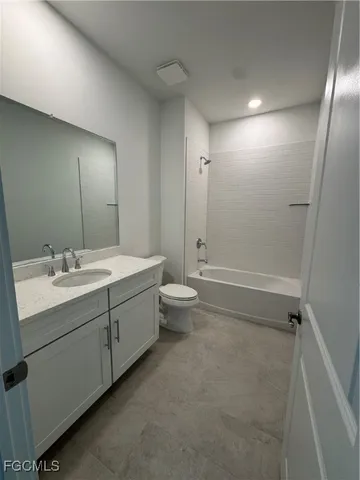 a bathroom with a double vanity sink toilet and shower