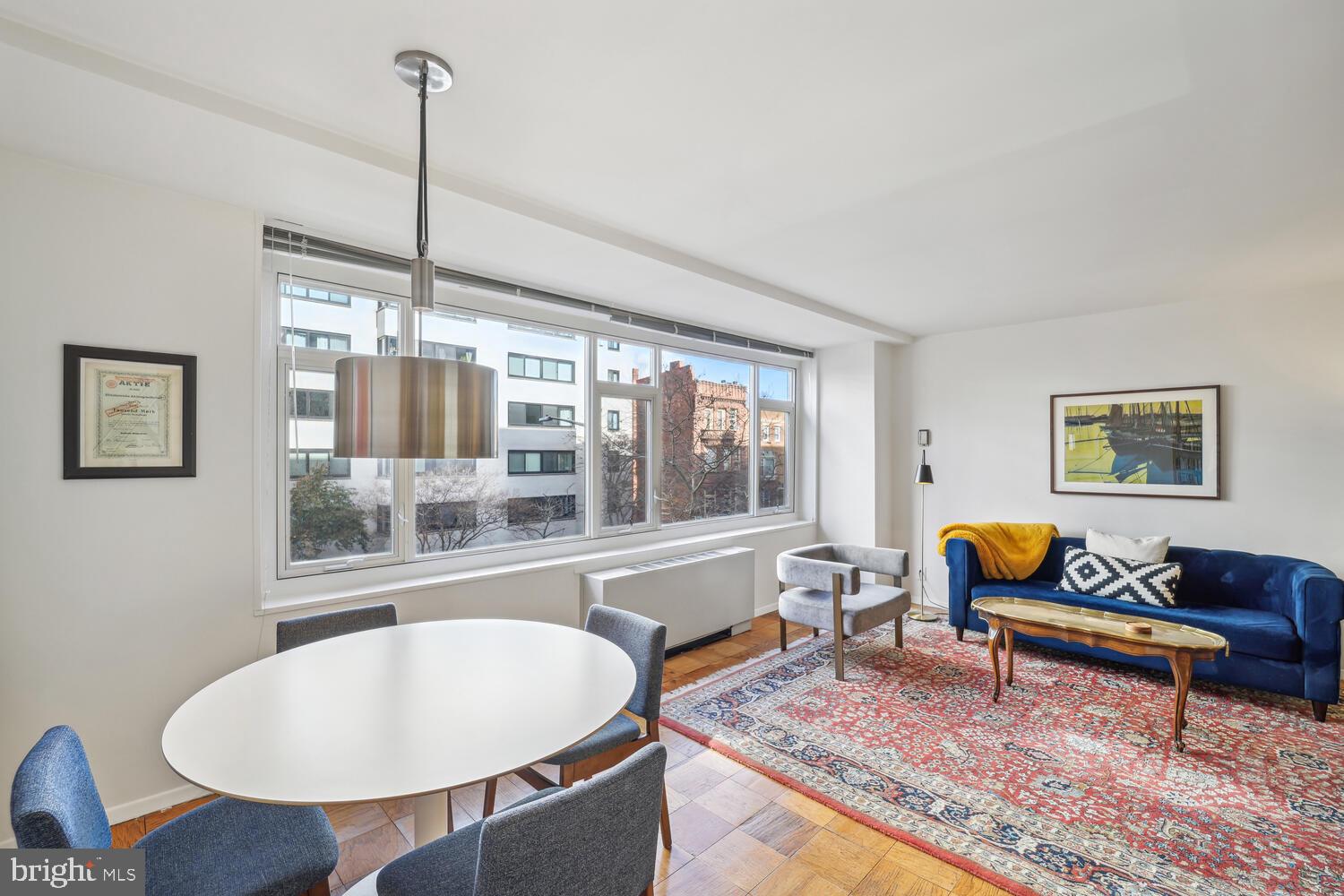 1545 18th Street Northwest, Unit 303 Washington, DC 20036 - Photo 10 of 23 Abundant natural light thru a wall of windows