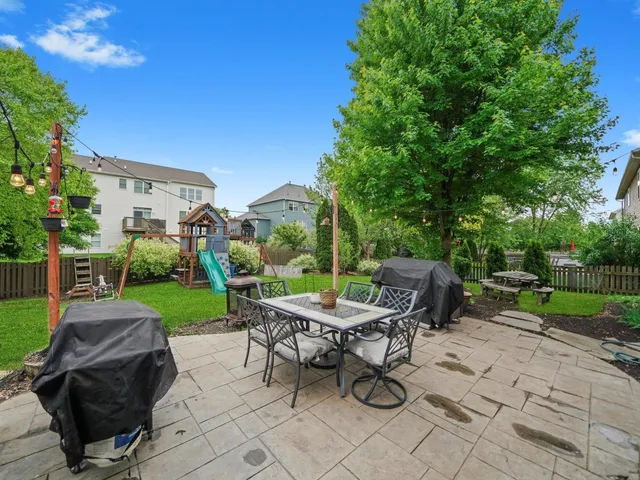a view of a backyard with sitting area