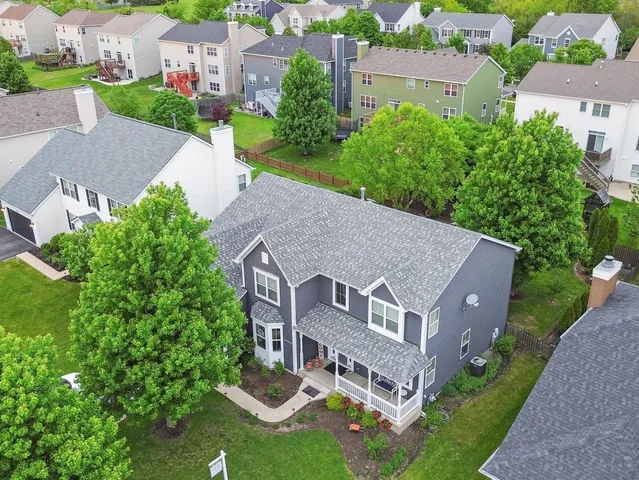 an aerial view of a house with a garden