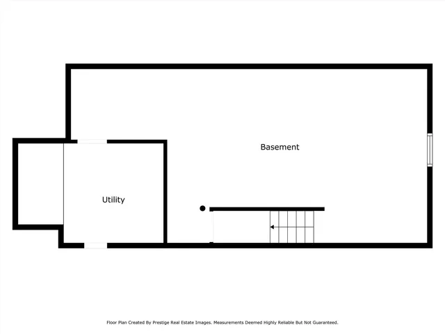 a picture of a room with a refrigerator