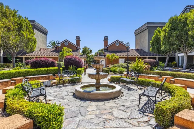 a view of a swimming pool with a lounge chairs