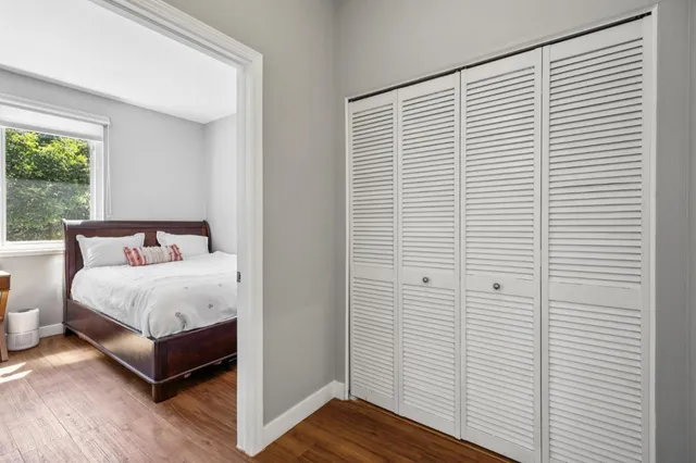 a spacious bedroom with a bed and a window