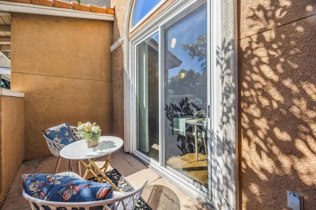 a view of balcony with wooden floor