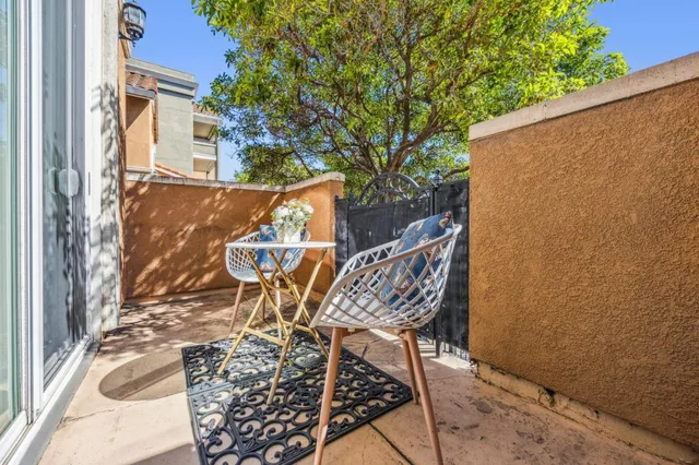 a front view of a residential apartment building with a yard
