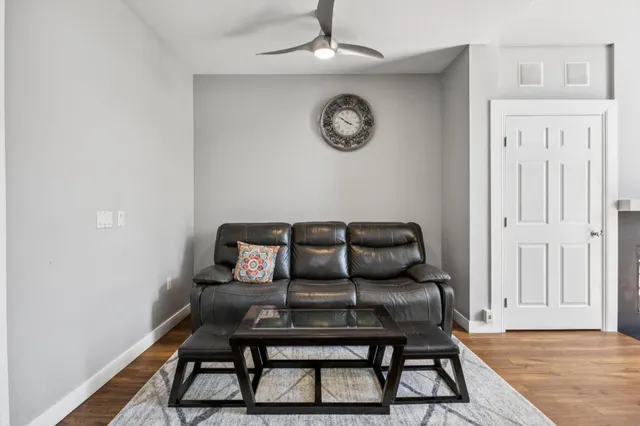 a view of a hallway with seating area