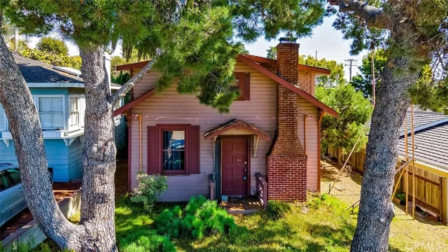 front view of a house with a tree