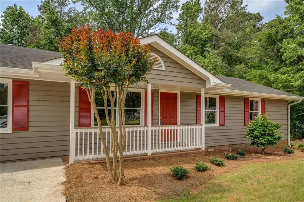 170 Hidden Pines Drive Covington, GA 30016 - Photo 1 of 22 a front view of a house with a yard