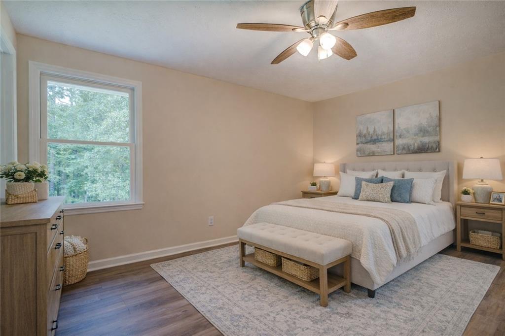 170 Hidden Pines Drive Covington, GA 30016 - Photo 11 of 22 a spacious bedroom with a bed and a window