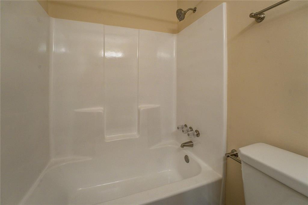 170 Hidden Pines Drive Covington, GA 30016 - Photo 18 of 22 a bathroom with a bathtub