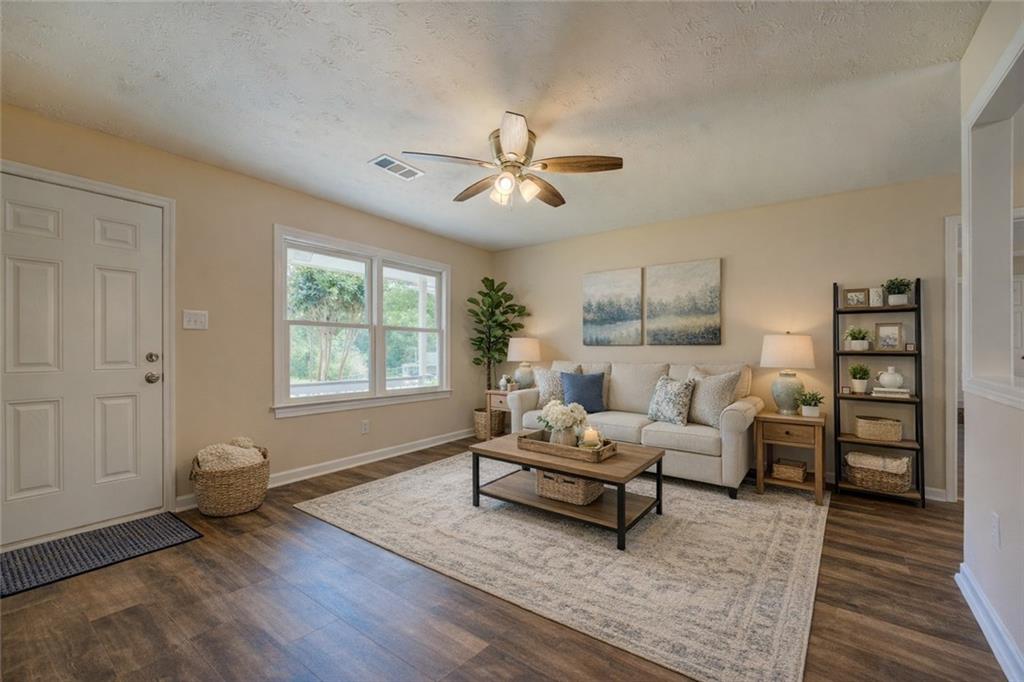 170 Hidden Pines Drive Covington, GA 30016 - Photo 2 of 22 a living room with furniture and wooden floor