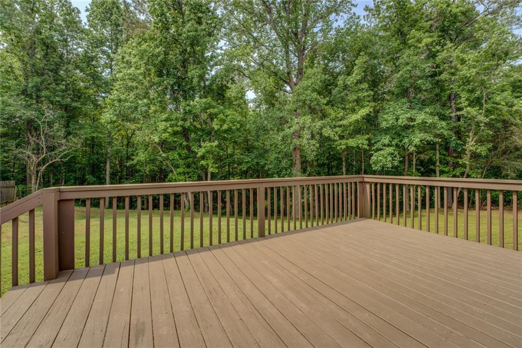 170 Hidden Pines Drive Covington, GA 30016 - Photo 21 of 22 a balcony with wooden floor and fence