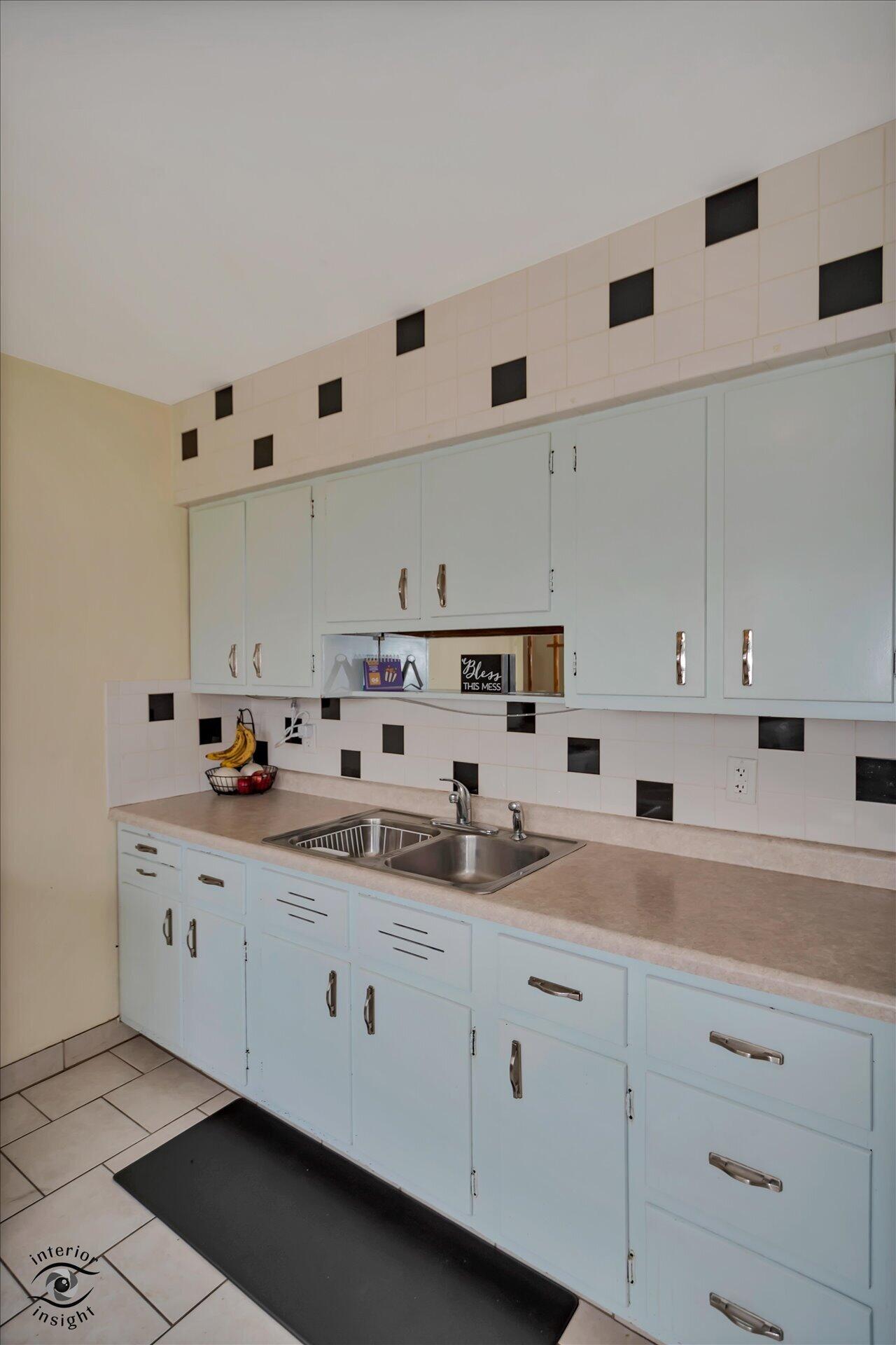 3341 Maple Drive Highland, IN 46322 - Photo 11 of 27 a kitchen with cabinets white stainless steel appliances and sink