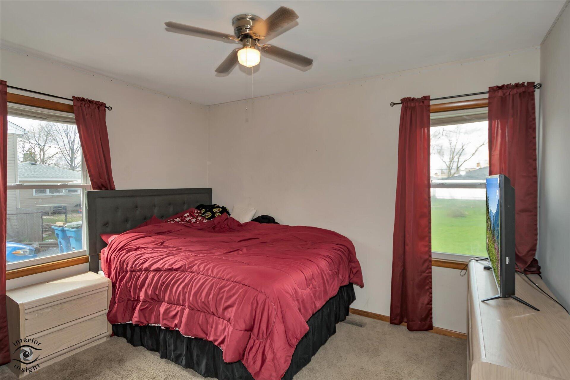 3341 Maple Drive Highland, IN 46322 - Photo 16 of 27 a bedroom with a bed and a window