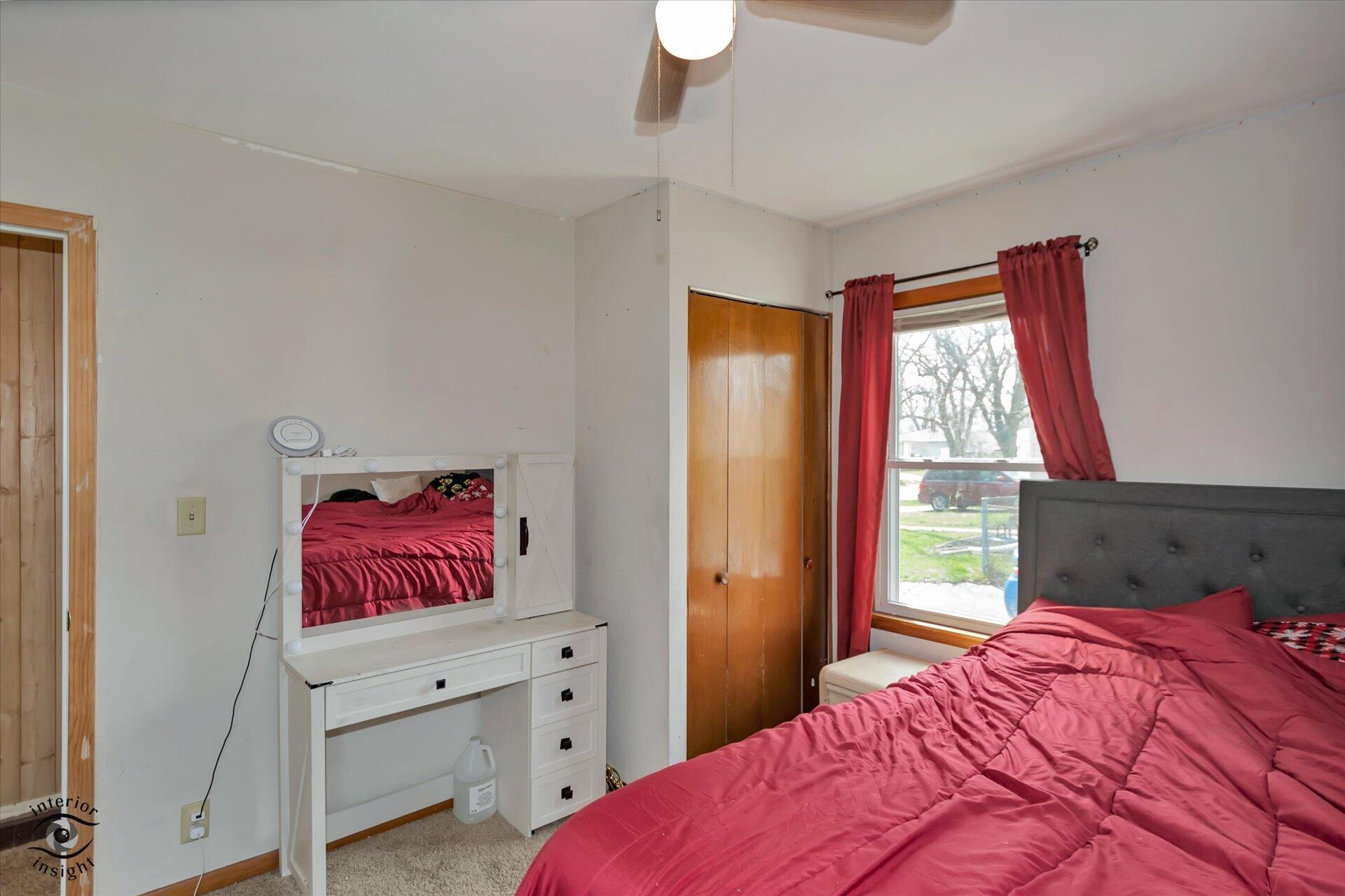3341 Maple Drive Highland, IN 46322 - Photo 17 of 27 a bedroom with a bed and a window