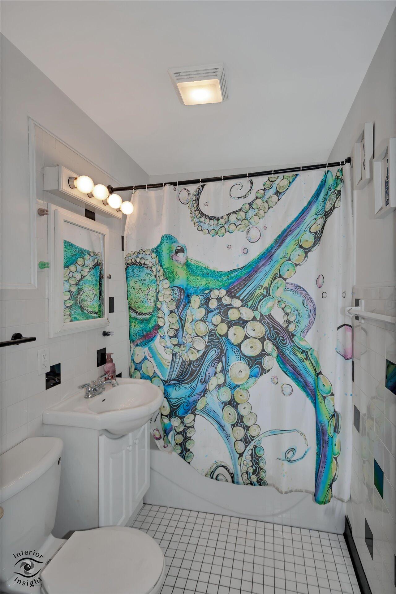3341 Maple Drive Highland, IN 46322 - Photo 19 of 27 a bathroom with a sink a toilet and a window