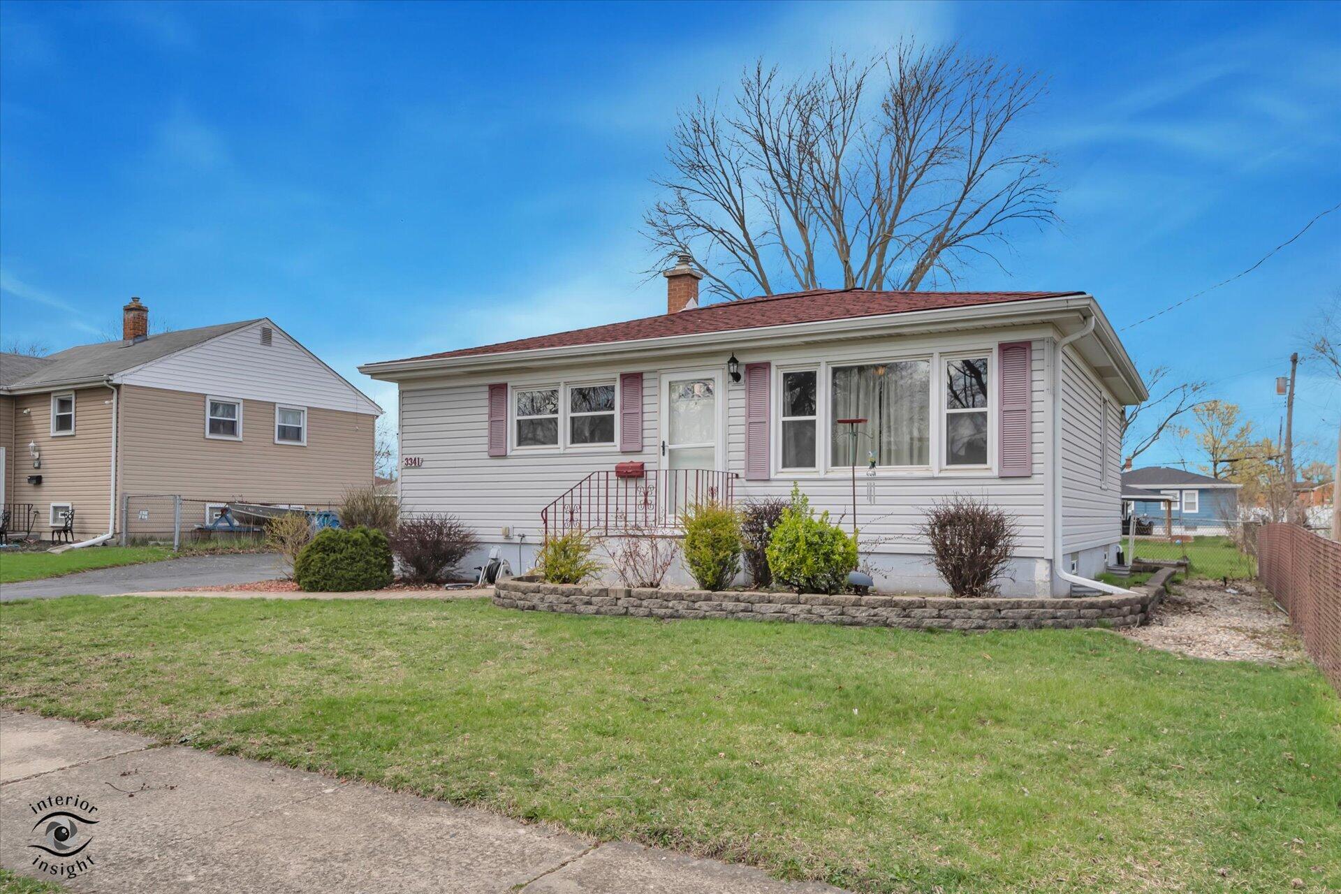 3341 Maple Drive Highland, IN 46322 - Photo 2 of 27 a front view of a house with garden