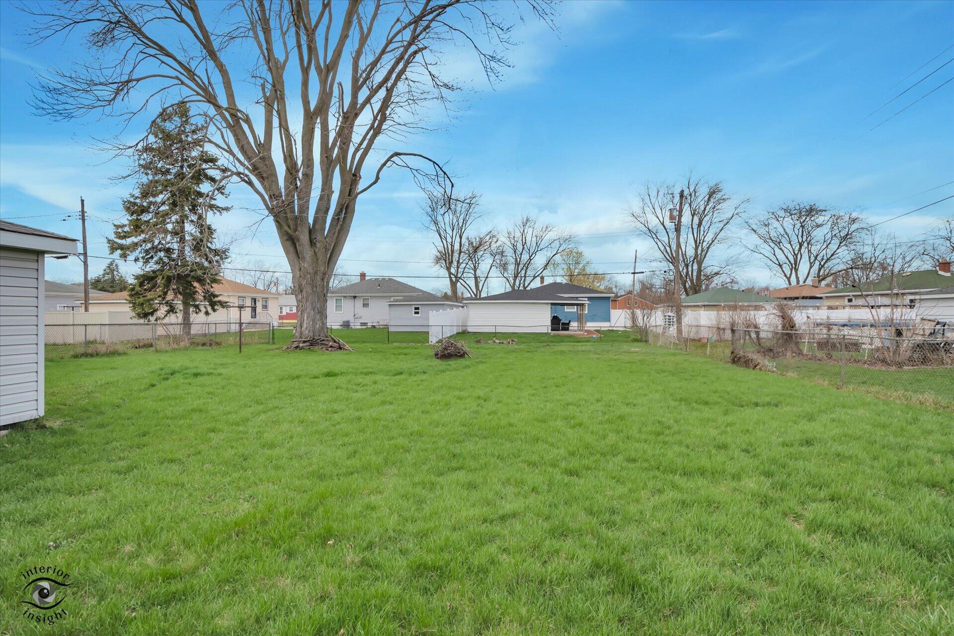 3341 Maple Drive Highland, IN 46322 - Photo 23 of 27 a view of a house with a backyard