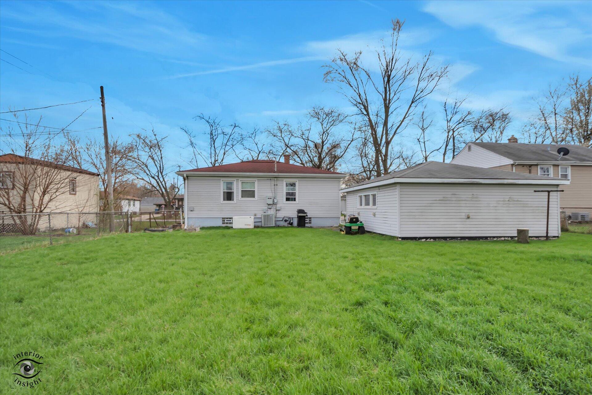 3341 Maple Drive Highland, IN 46322 - Photo 26 of 27 a view of a house with backyard and a tree