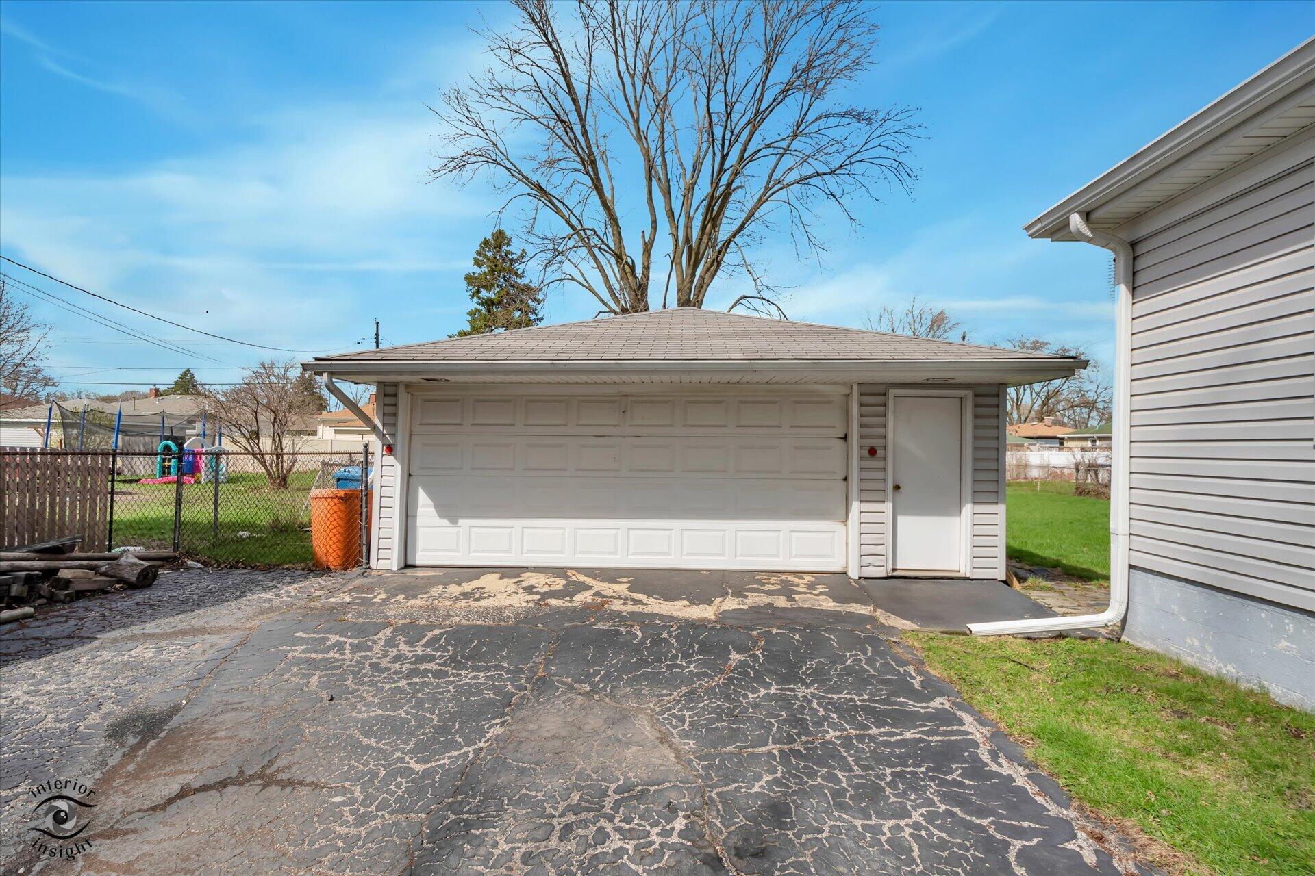 3341 Maple Drive Highland, IN 46322 - Photo 27 of 27 a front view of a house with a yard and garage