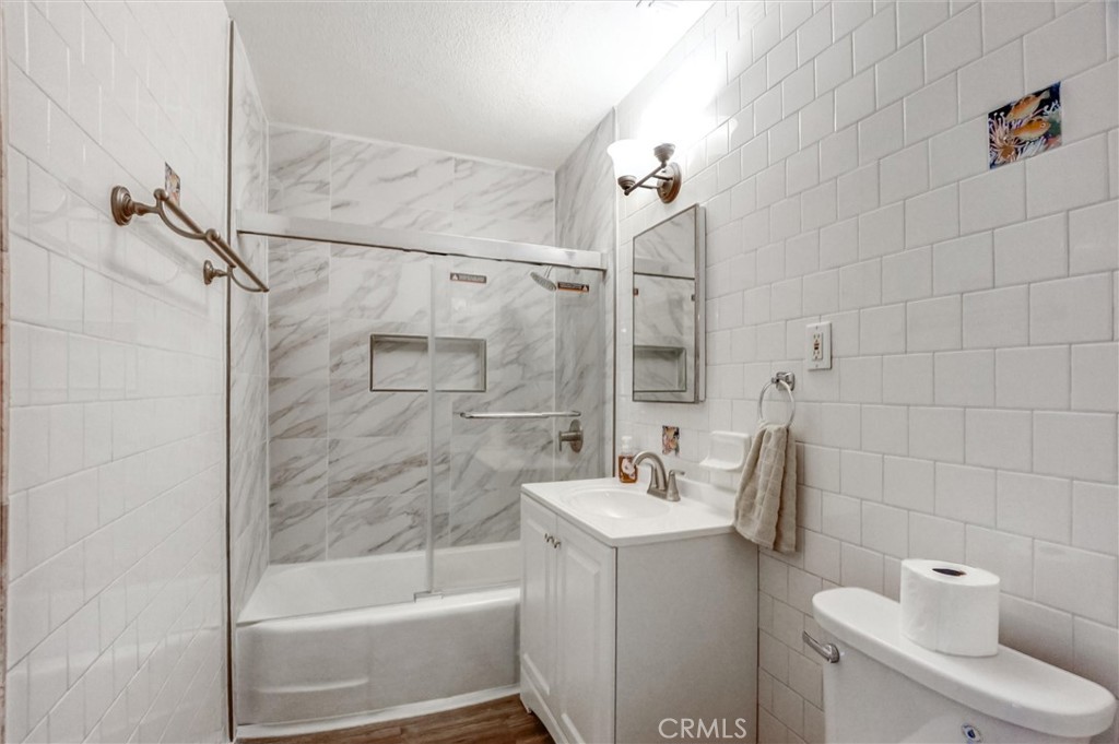 2734 Serrano Road North San Bernardino, CA 92405 - Photo 14 of 25 a bathroom with a sink a toilet and shower